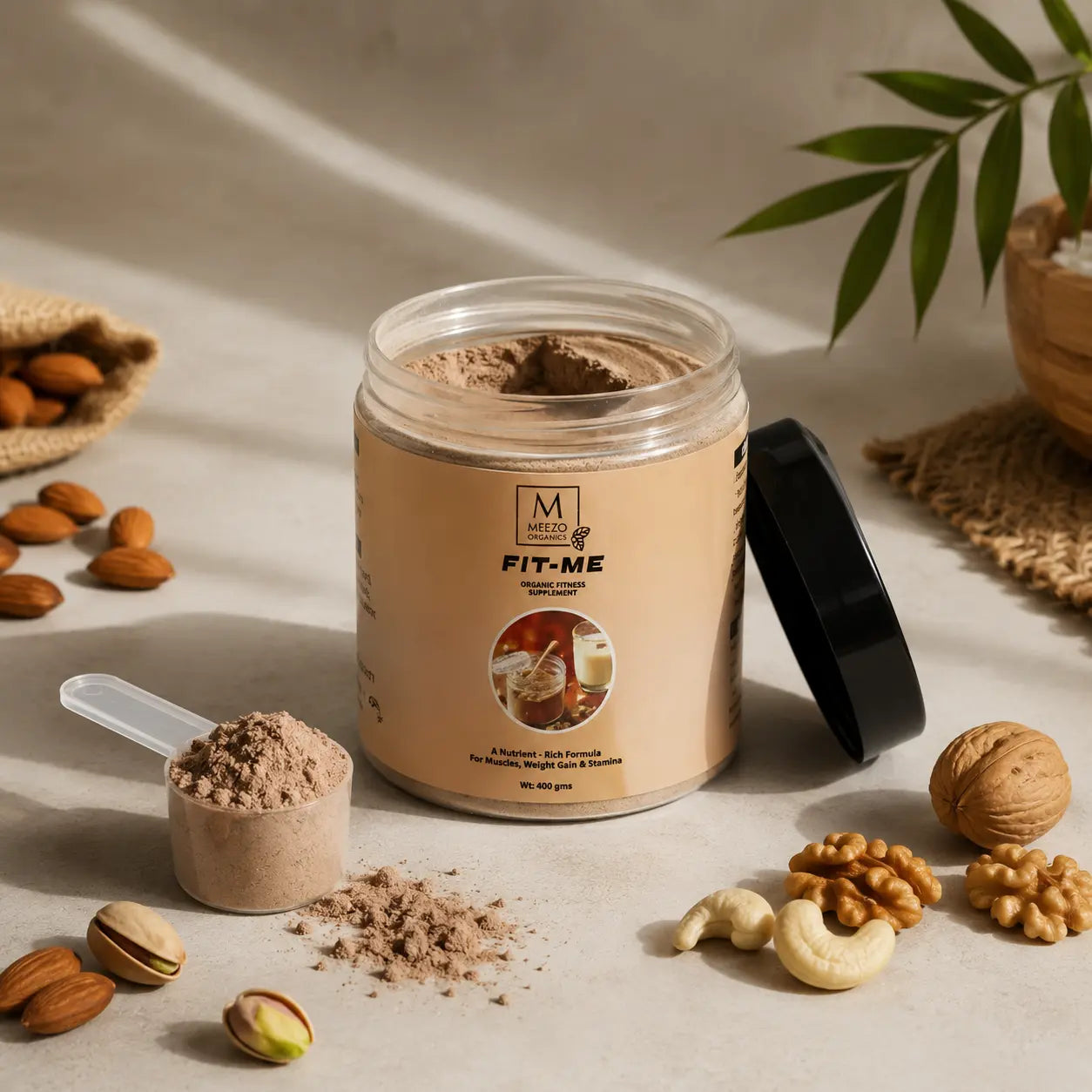 Jar of Mezzo Fit-Me protein powder with a scoop and nuts on a neutral background